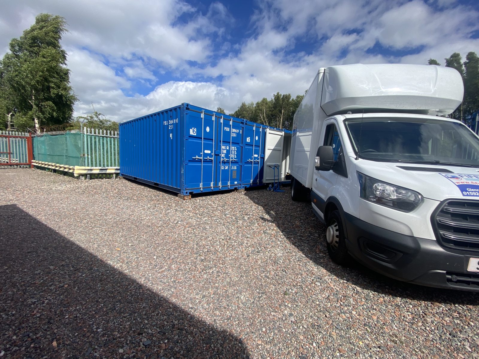 a van unloading items into a self storage unit